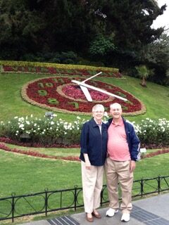 picture of husband and wife standing in front of the Vina Del Mar Flower Clock