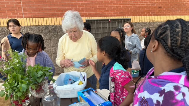 a woman volunteering with children around